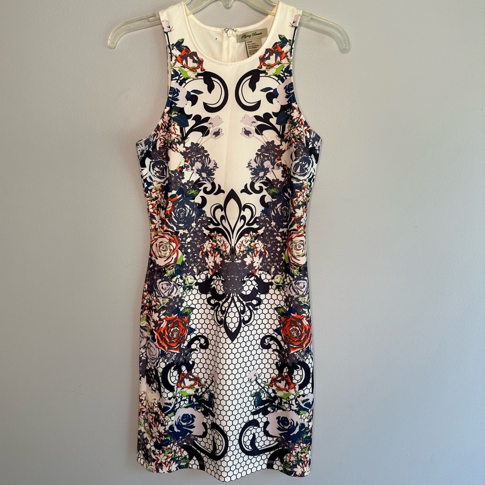 White body con dress in a wild print.